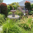 May 2017 Garden Tour Front courtyard garden of Francine and Walter Stout. Art and Peggy Miller in background.